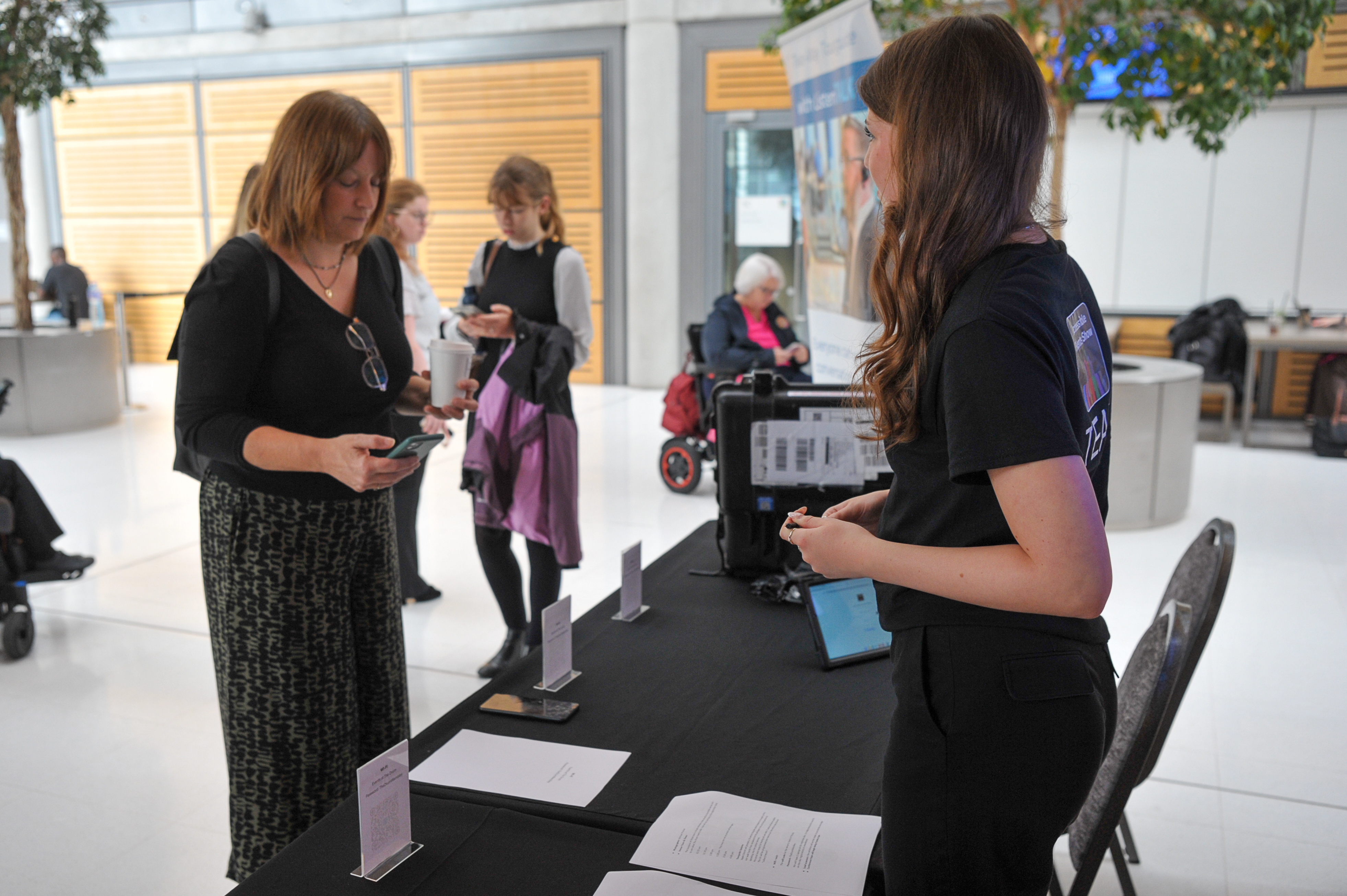 Delegates at the Accessible Events Show registration desk 2025